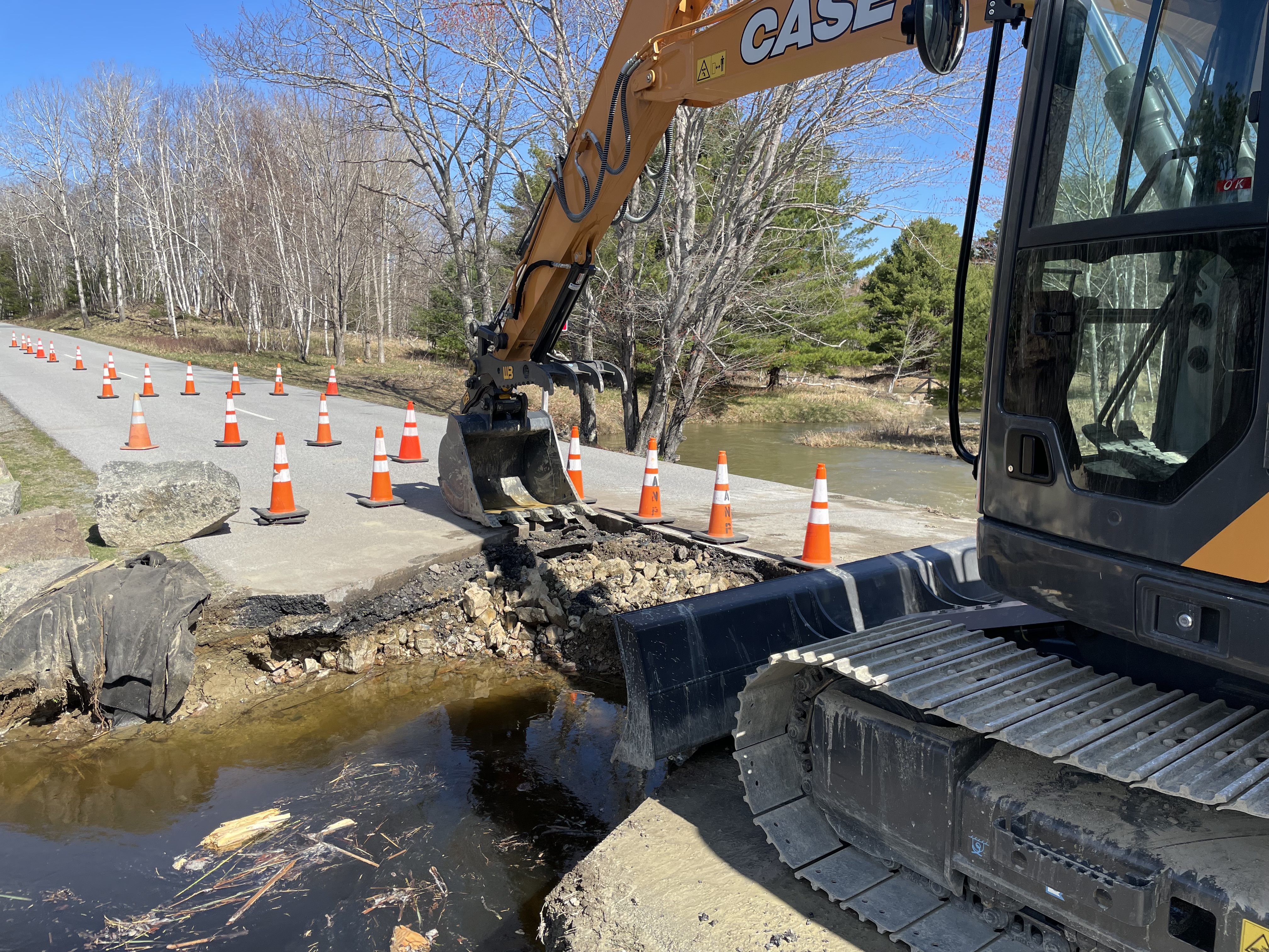 One of two culverts to be repaired at Acadia National Park. The photograph shows that half of the culvert and road has been removed.