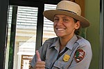 Female park ranger gives thumbs-up