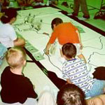 School children play a game in the visitor center