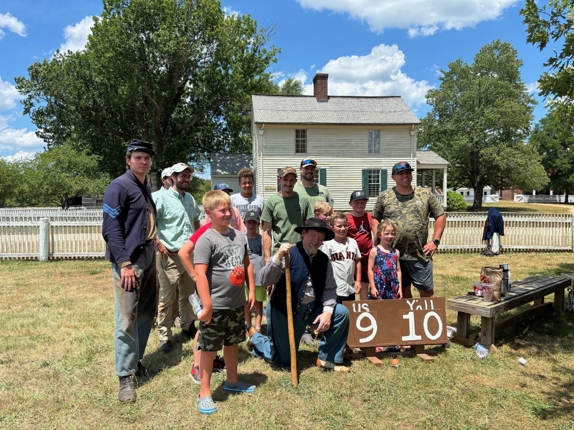 A small group of baseball players pose for a photo.