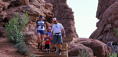 Hikers on the Windows Trail (Turret Arch in background)