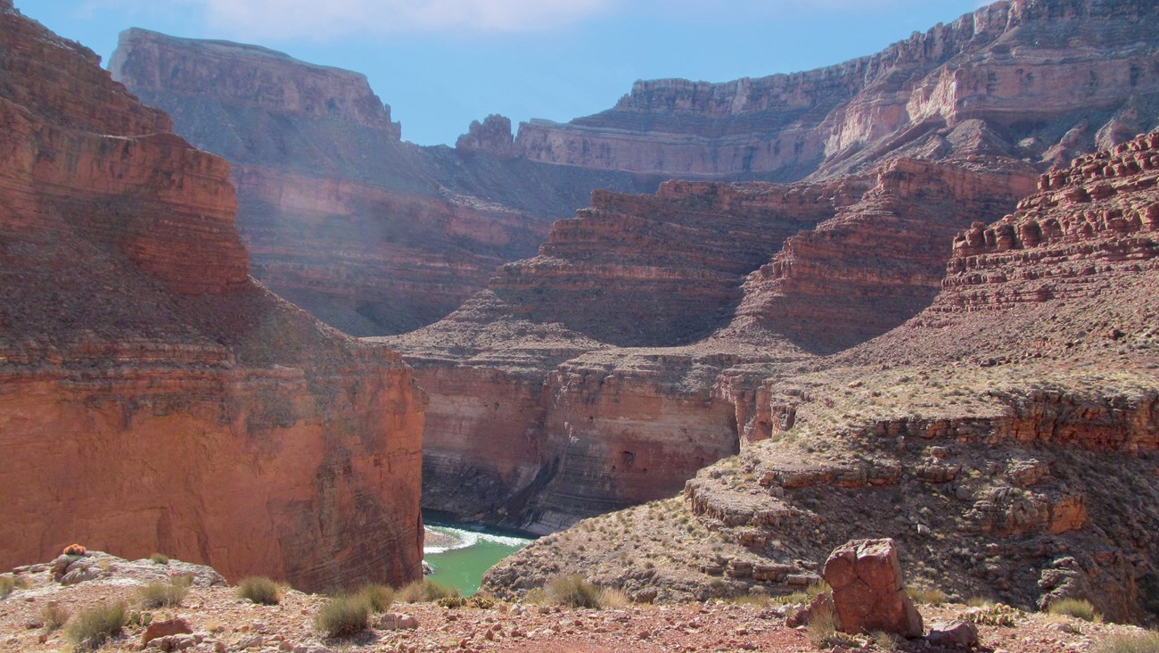 View into the canyon with a river bend showing at the bottom of the redwall canyon.
