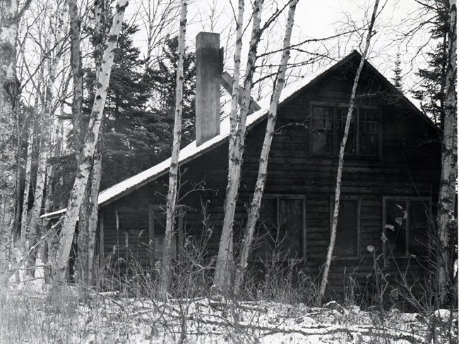 triangular, 1.5 story, wood shingled cabin