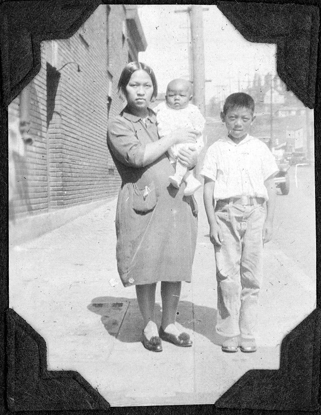 Black and white portrait of Chinese American woman with young boy and baby.