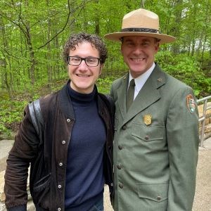 Teddy Abrams is shown standing next to the Park Superintendent of Mammoth Cave.