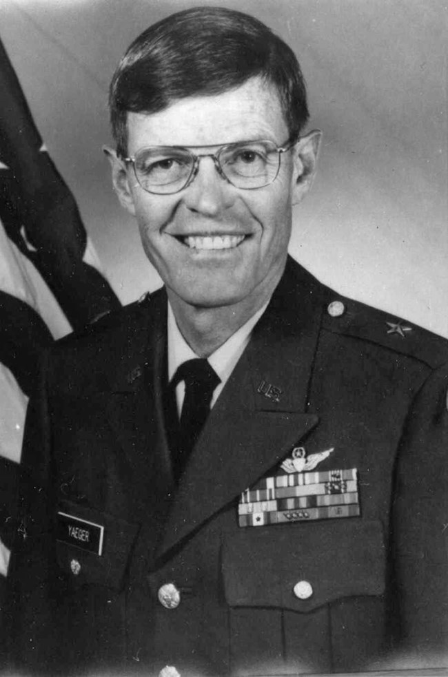 Black and white headshot of white man in military uniform with cap