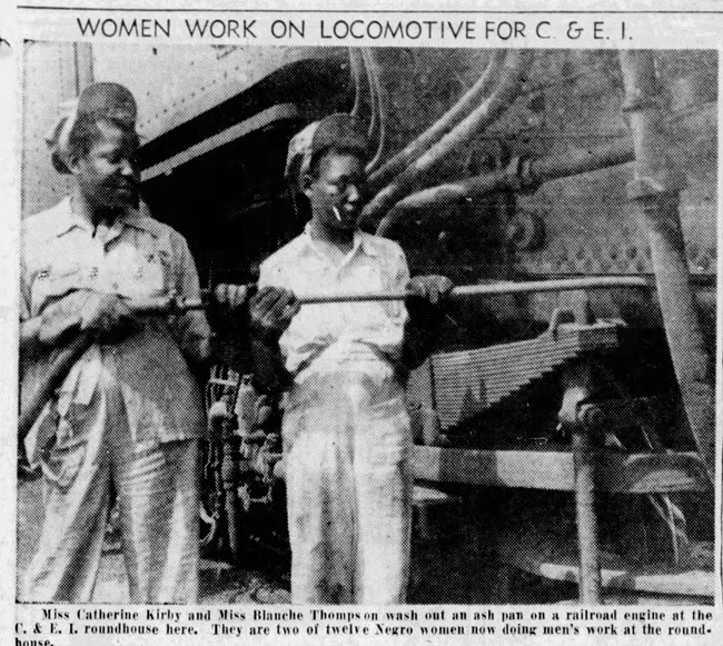 Black and white grainy photo of two Black women with a large metal tool in a work area