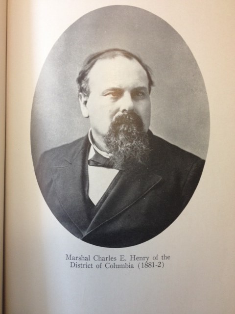 man in a suit has a long brown beard