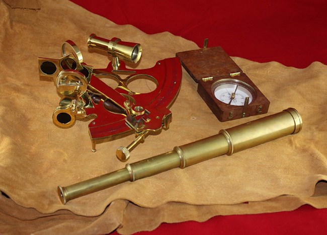 Sextant, pocket compass, and telescope