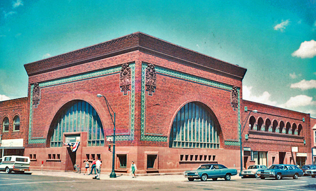 Brick building with arched windows.