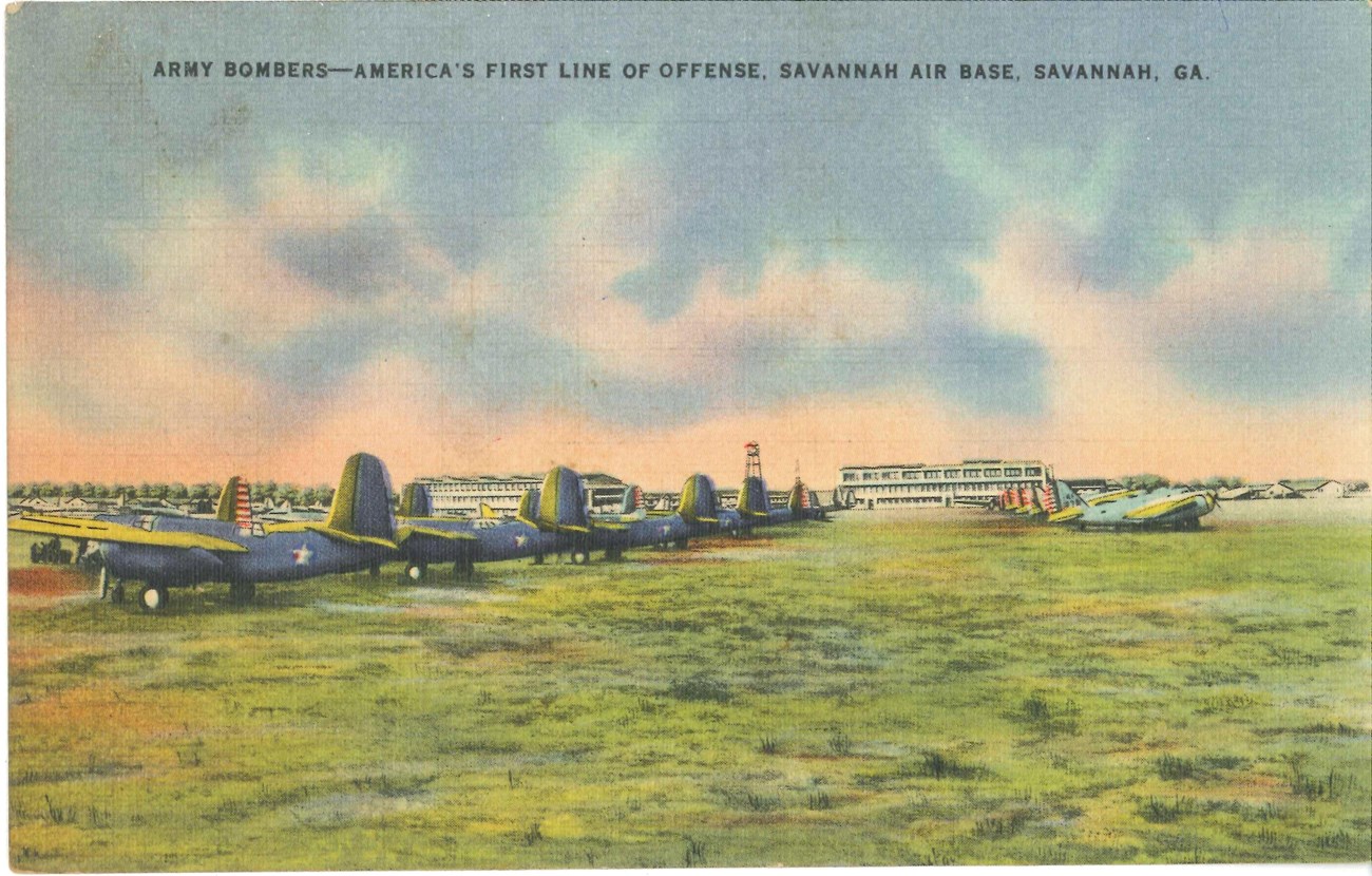 colored postcard of planes in a row in front of a building at an airbase