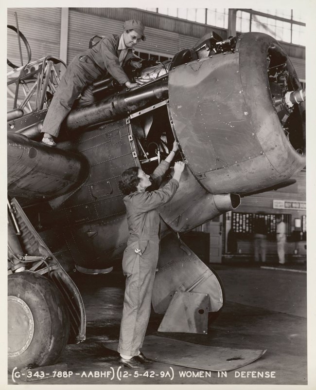 two women engaged in industrial work