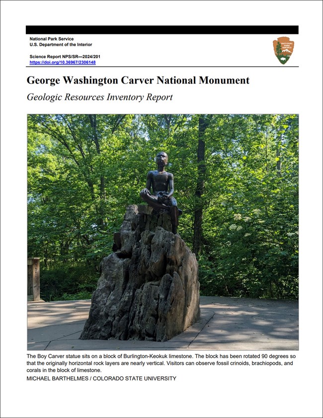 Image of the cover of a geologic report with a photo of a statue of a boy