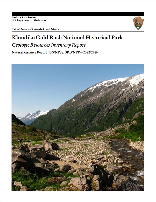 Image of report cover with photo of a rocky stream bed in a mountain valley.