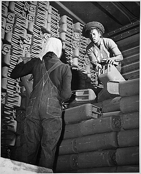 black and white photo of two African American women doing industrial work