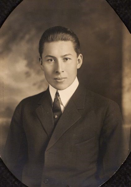 portrait-style sepia tone photo of a man in a suit