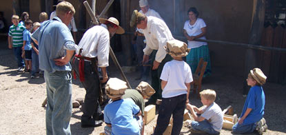 Children working with the craftsmen.
