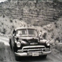 Park ranger drives the narrow Hot Springs road, 1954