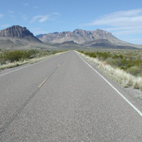 Nugent Mountain and Pummel Peak rise above the road.