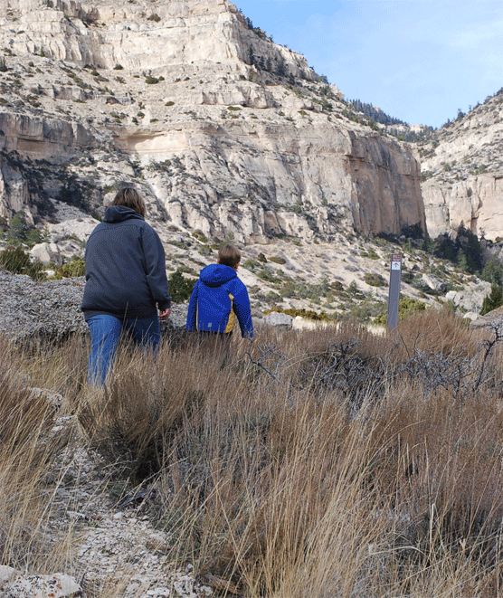 Mother and son hiking the Upper Layout Creek Trail on a crisp fall day.&nbsp;