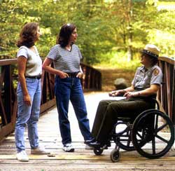 Ranger in a wheelchair talking to visitors