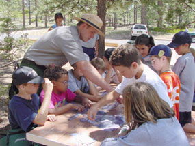 Park Ranger interacting with children during an interpretive program