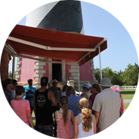 Visitors talking with a ranger before climbing Cape Hatteras Lighthouse