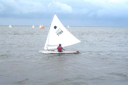 Small sailboat racing in the sound.