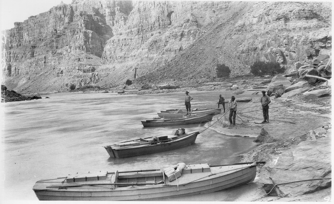 Black and white photo of boats from a 1921 USGS Expedition in Cataract Canyon.