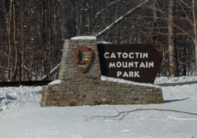 Catoctin Mountain Park entrance sign in snow.