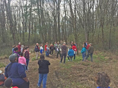 A park ranger leads a tour through the woods of Moccasin Bend