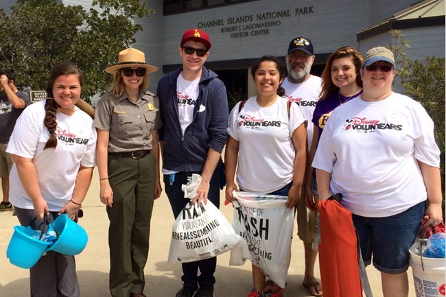 Ranger with volunteers at coastal cleanup day.
