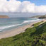 sandy beach of cuyler harbor with prince island in distance