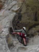 Climber working for position on Bath Rock