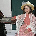 Child dressed in 19th century costume during Clara Barton National Historic Site's Victorian Greeting Card Workshops.