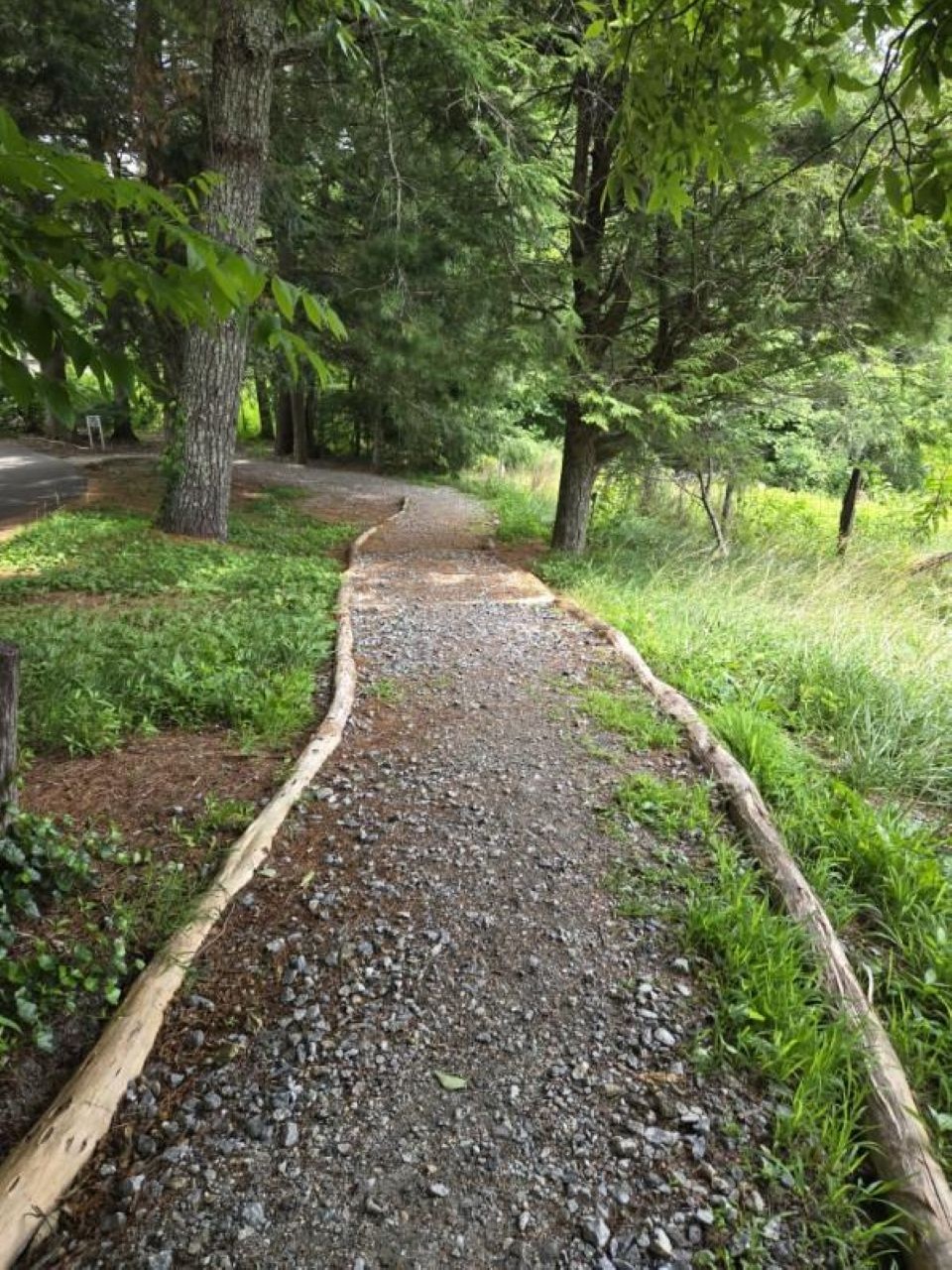 A gravel trail that was completely washed away, underground pipe exposed