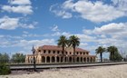 A historic train depot building, in the desert