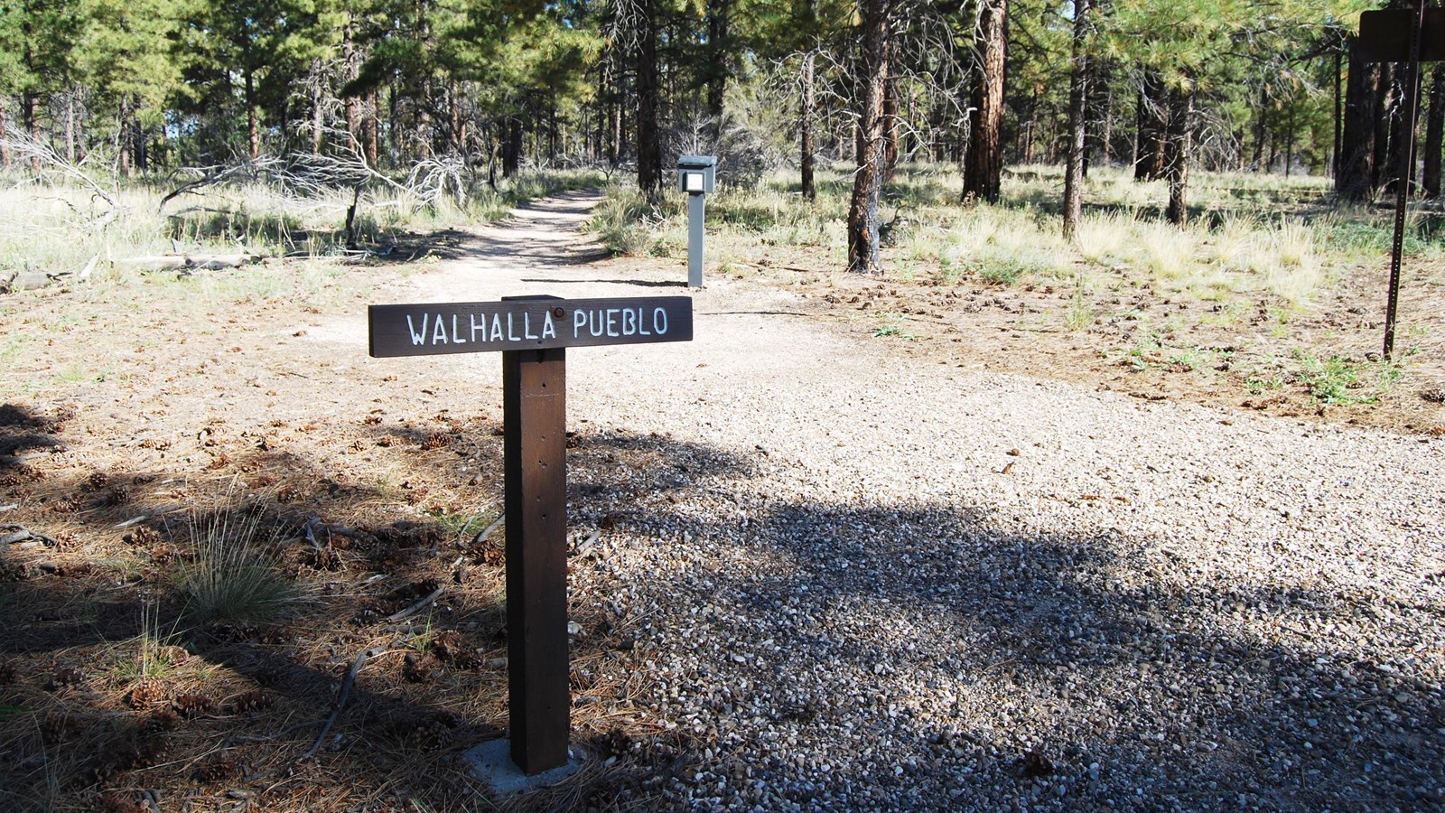 A brown sign that reads 