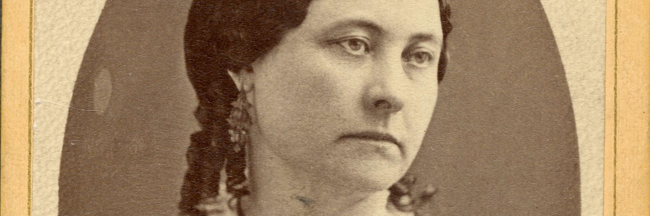 Photo of Maria Barclay wearing a dark-colored dress with a lacy collar.