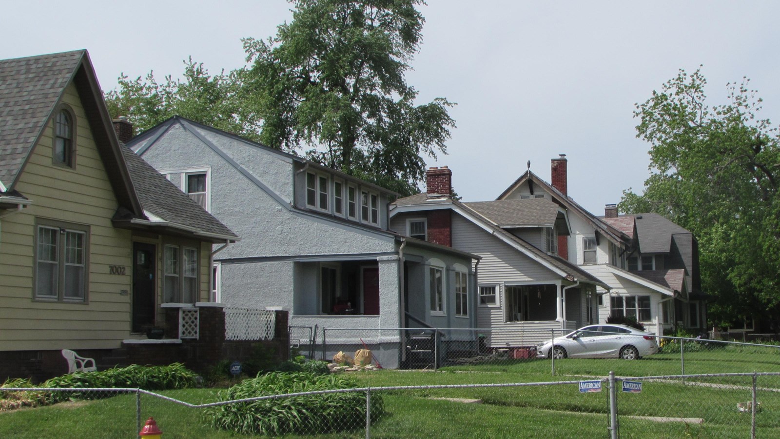 Small, frame bungalow homes with deep set backs, winding streets, heavily treed neighborhood.