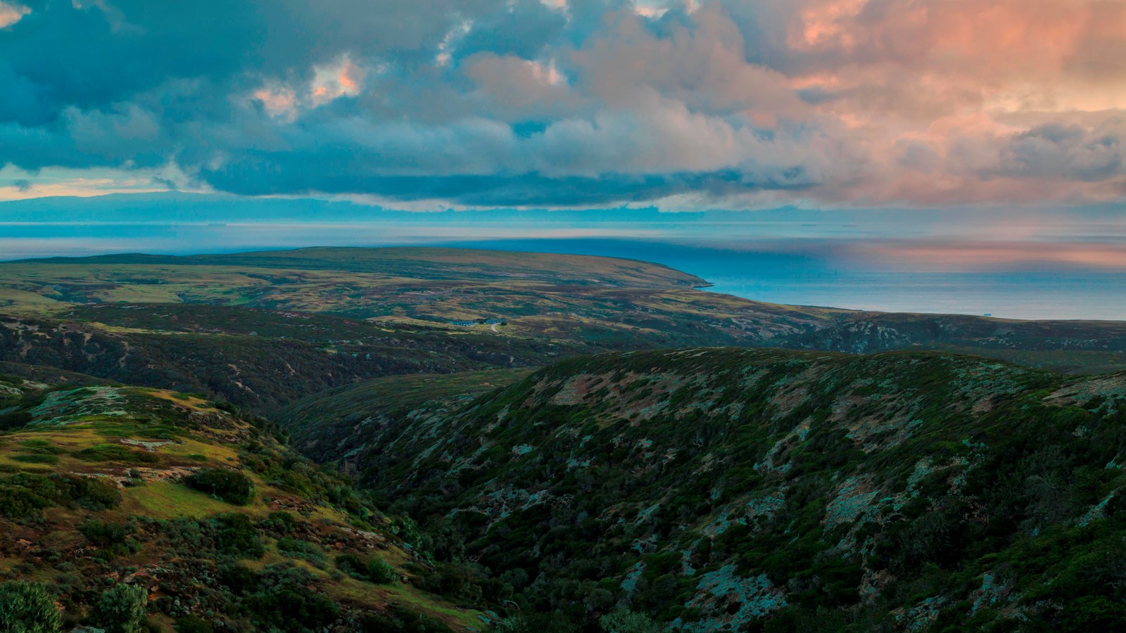 view of coast and channel from mountain top