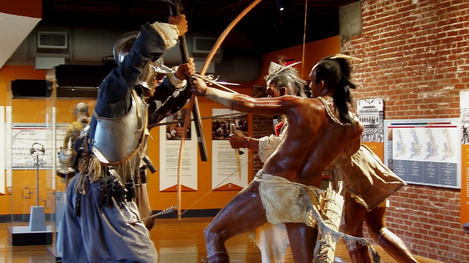 Exhibit with conquistadors clashing with native americans