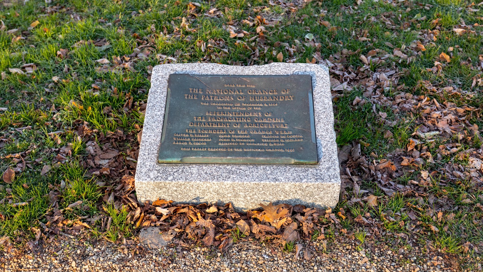 A bronze plaque on a granite stone.