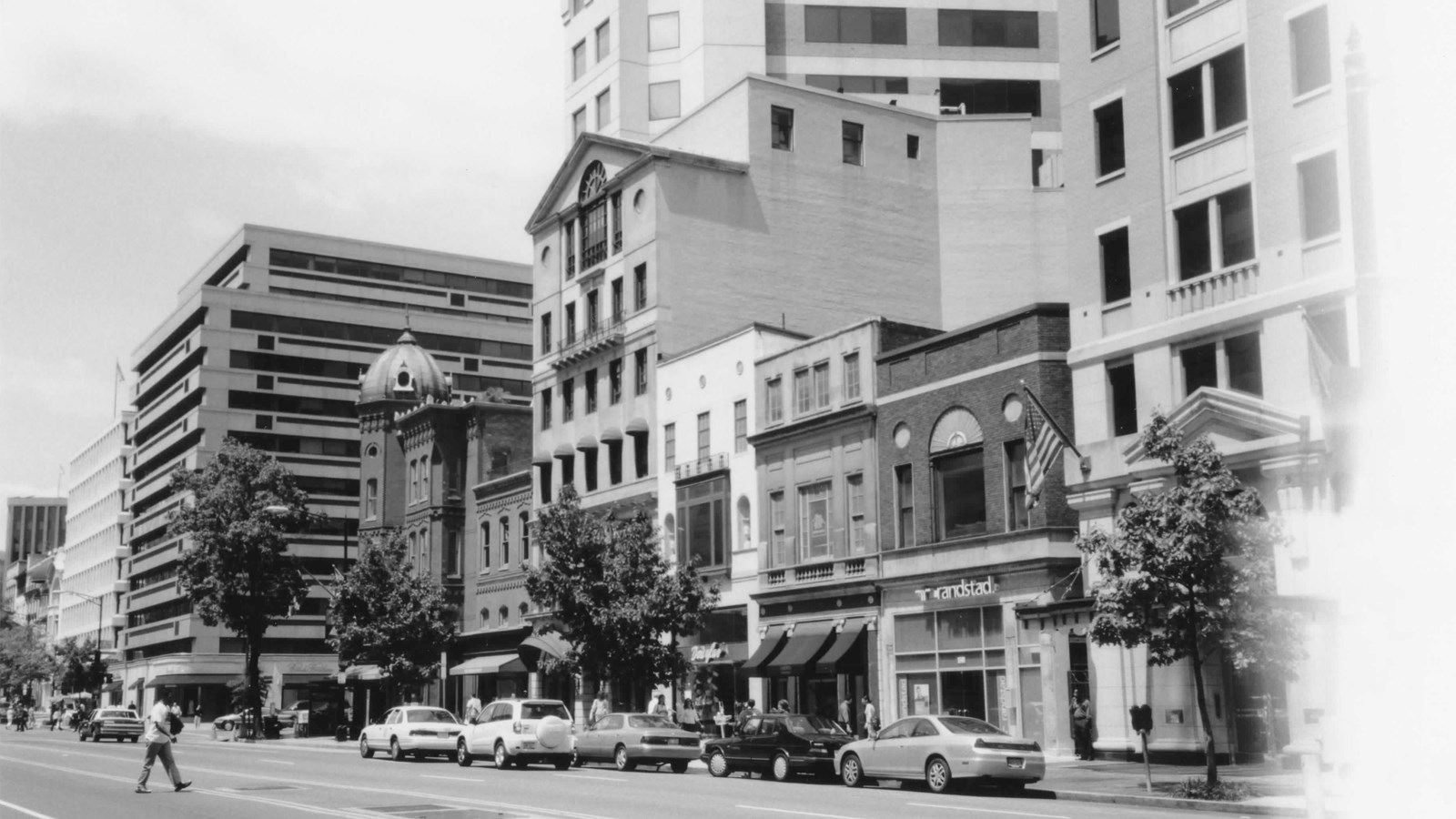 City street featuring Georgian Revival, tall office building