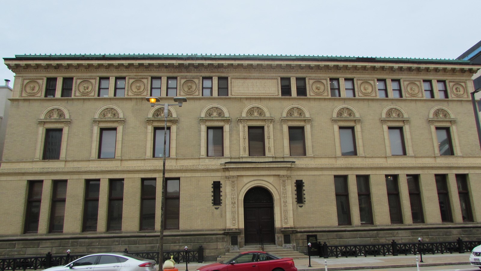 Three story Second Renaissance Revival with centered arched entrance. Windows vary at each level