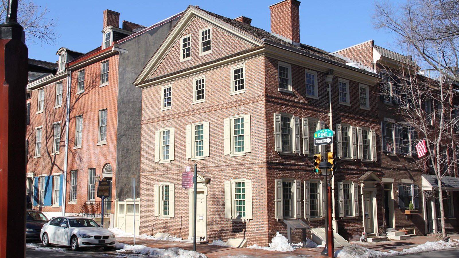 A three-and-a-half story colonial brick house.