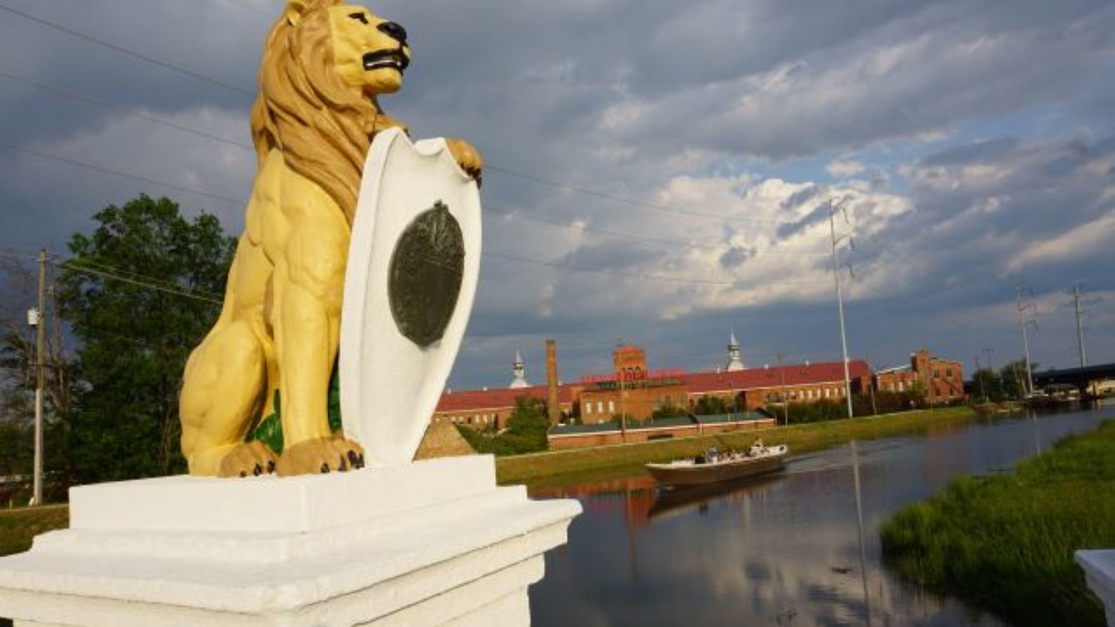 Lion statue along bank of canal