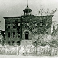 The Avery Normal Institute in 1870, surrounded by picket fence.