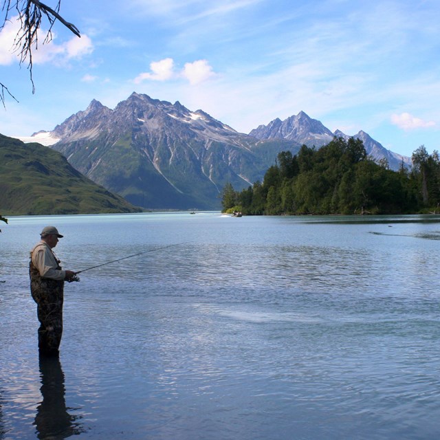 man fishing in a lake