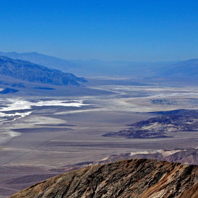 Dry desert valley surrounded by mountains